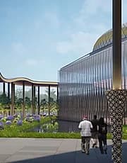 Visualisation of a civic building with a fluted metal facade and shallow dome, approached across landscaped grounds