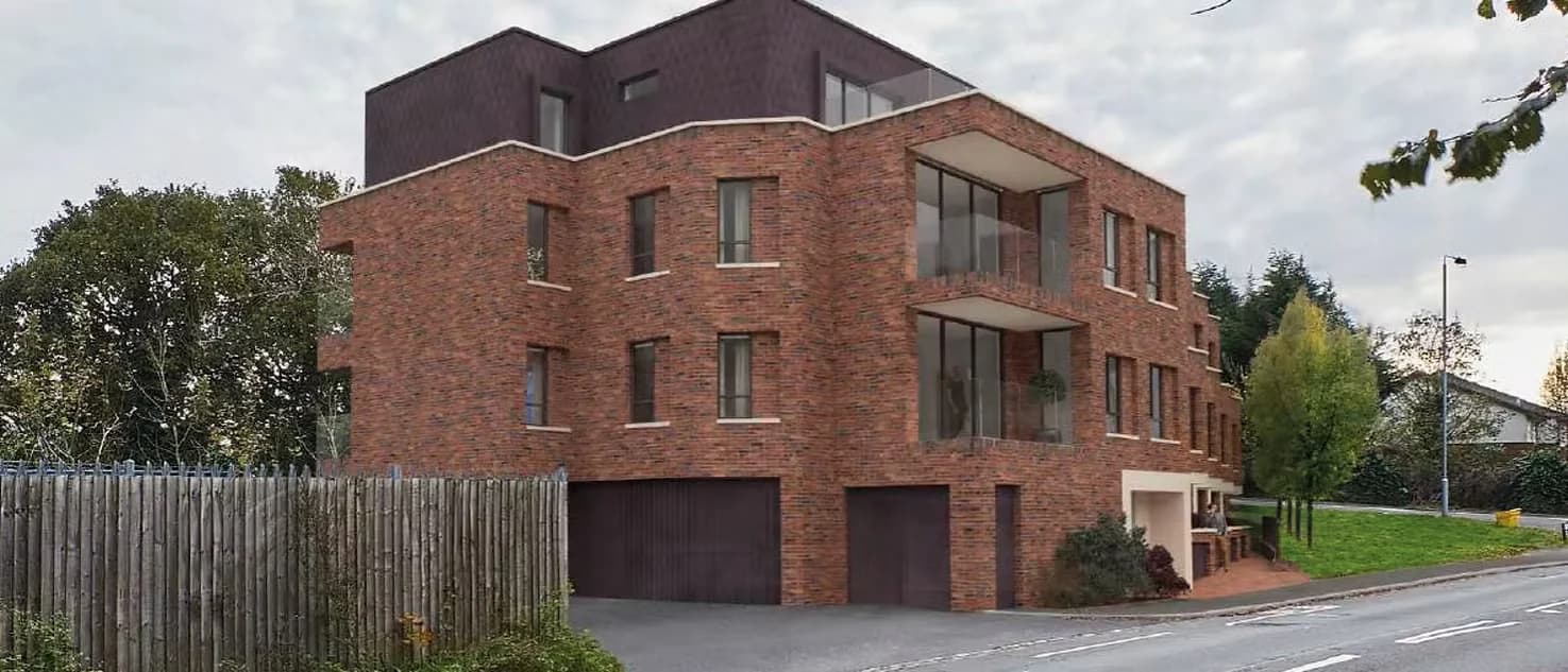 Visualisation of the building from the road, red brick with a dark set-back top storey
